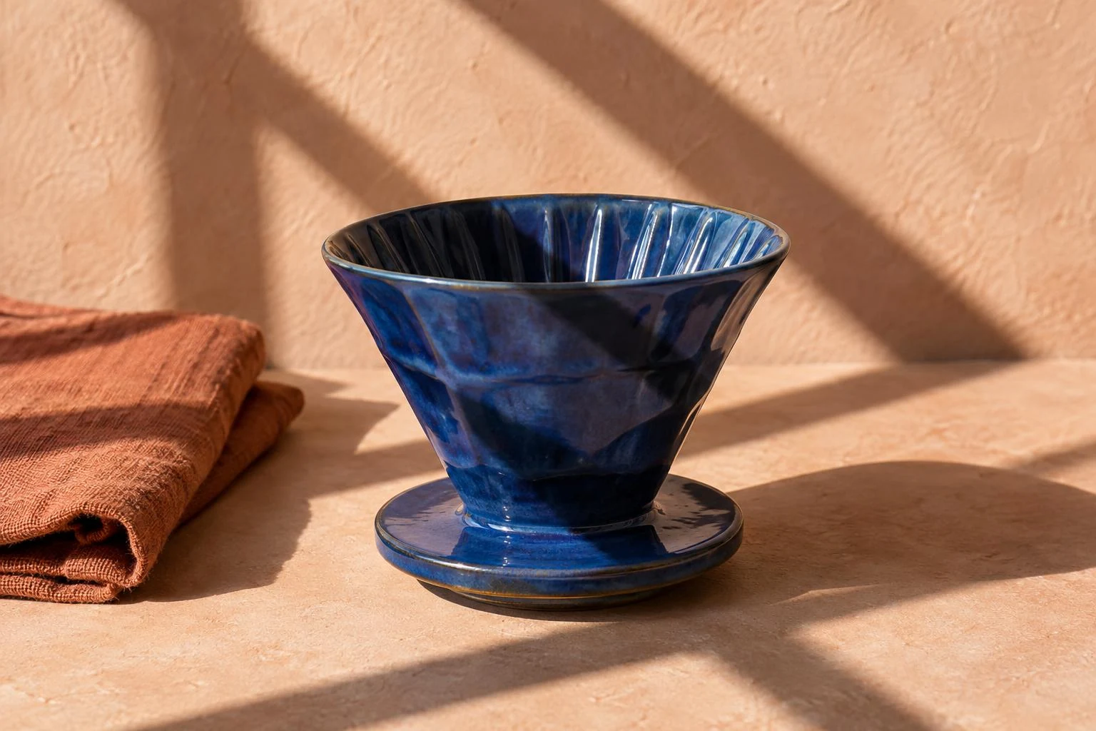 Remove shadow from photo — blue ceramic dripper and peach tabletop crossed by window shadows.